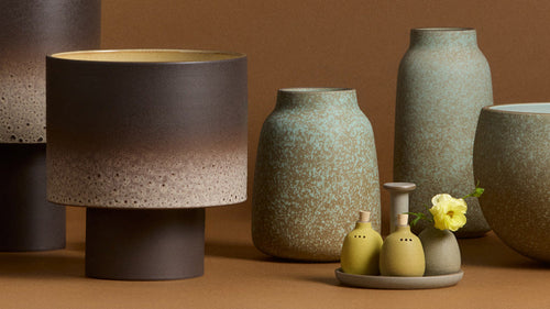 Collection of Hand Thrown Neck Vases in various sizes in bright yellow.